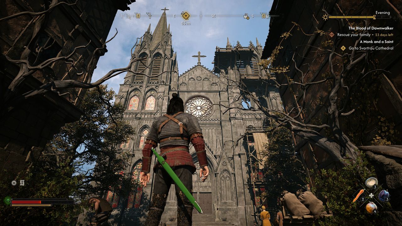 A man looks up at a giant cathedral