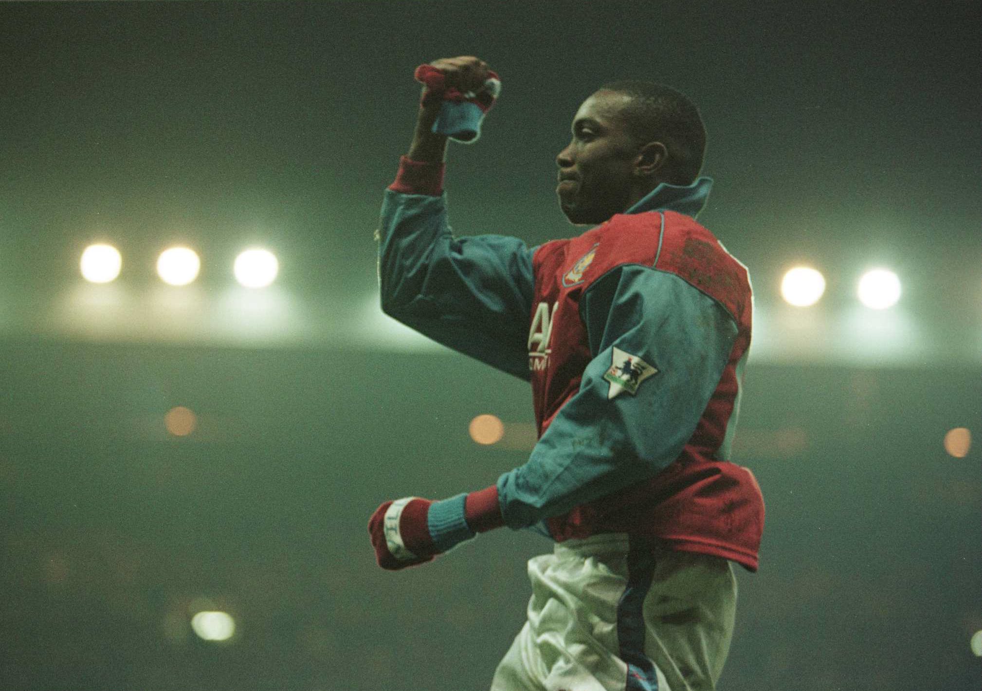 Dwight Yorke celebrates a goal for Aston Villa against Tottenham in January 1996.