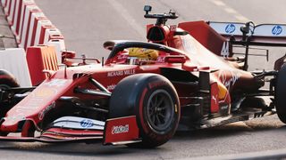 Lewis Hamilton drives a Ferrari single-seater F1 car during the Scuderia Ferrari HP Drivers' Presentation in Milan, in March 2025