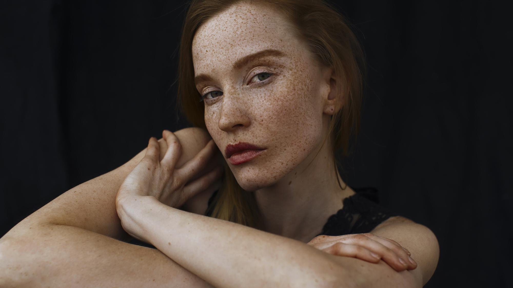 Woman with freckles and matte skin