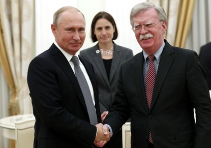 John Bolton and Vladimir Putin