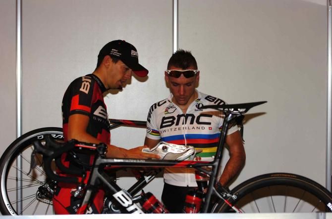 Gilbert and Morabito make sure their cleats are positioned correctly