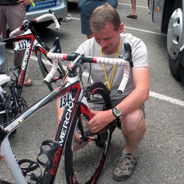 A mechanic makes an adjustment to the bicycle of Dries Devenyns.