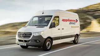 An Appliances Direct van driving 
