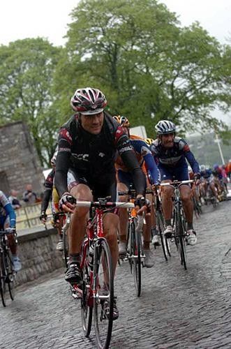 Ivan Basso (CSC) navigating the wet cobbles