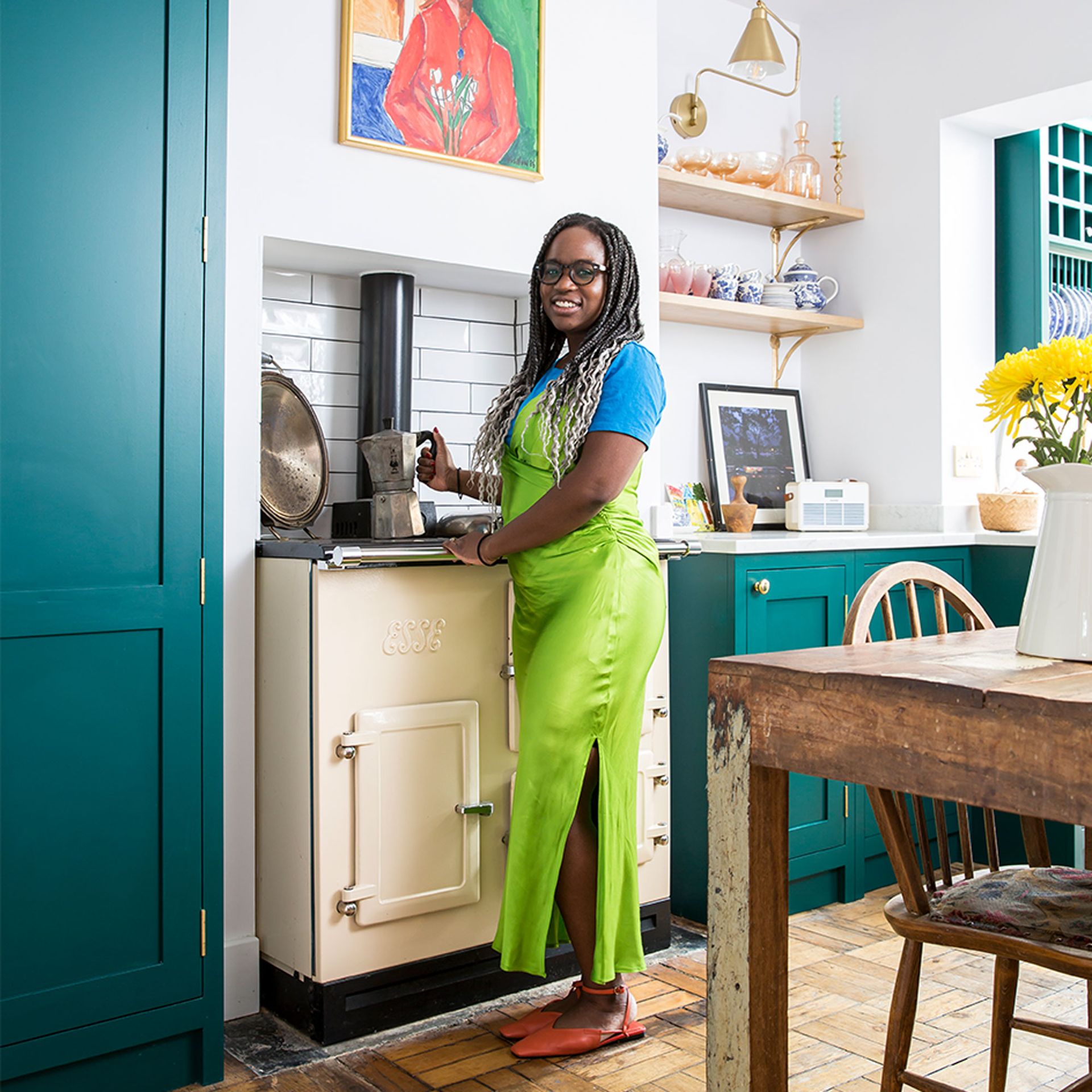 green kitchen with owner