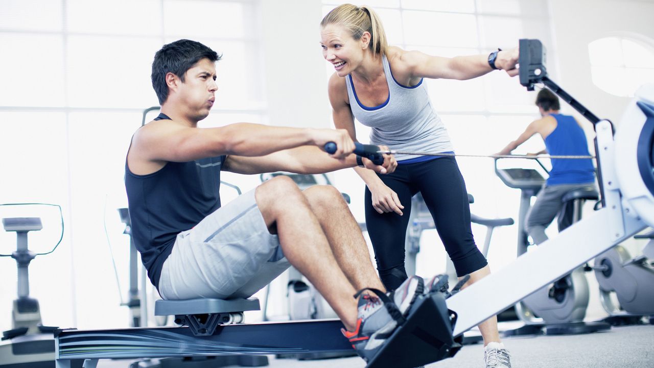 Man doing a rowing machine workout