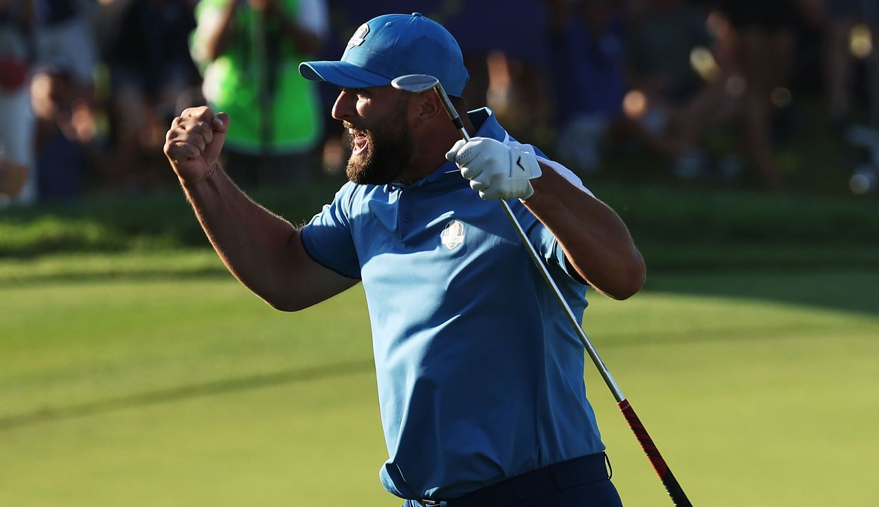 Jon Rahm fist pumps after chipping in