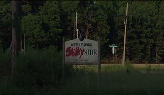 Shadyside's town sign is defaced with graffiti in Fear Street.