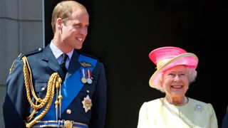 Prince William, Duke of Cambridge and Queen Elizabeth II watch a flypast of Spitfire & Hurricane aircraft
