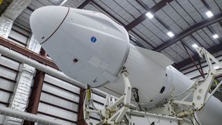 SpaceX's Falcon 9 rocket, topped with the Dragon spacecraft, is seen in hangar at NASA's Kennedy Space Center in Florida on Aug. 24, 2021.