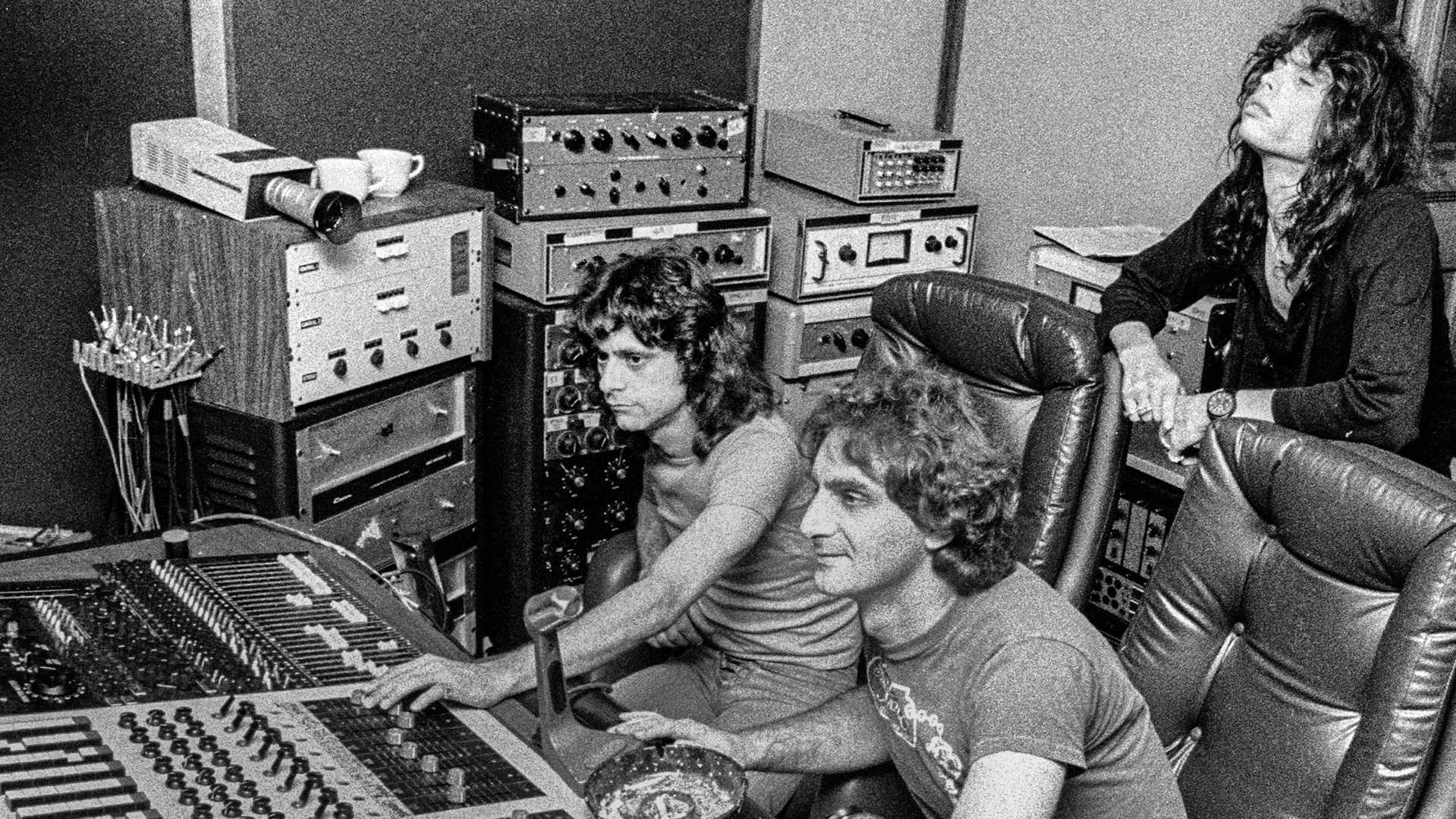 Jay Messina, Jack Douglas and Steven Tyler listen to playback of tracks for Aerosmith's Draw The Line Lp, while recording at The Cenacle in Armonk NY, May 15, 1977