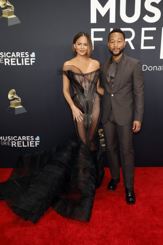 Chrissy Teigen and John Legend attend the 67th Grammy Awards.