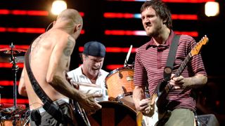 Flea, Chad Smith, and John Frusciante of the Red Hot Chili Peppers perform as part of the Coachella Music and Arts Festival at Empire Polo Fields in Indio, California.