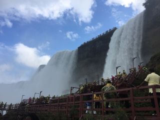 Tourists can walk to the bottom of Bridal Veil Falls, on the right, and American Falls.