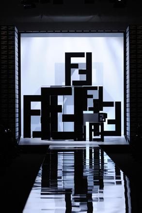 Large black letter F projected on the walls