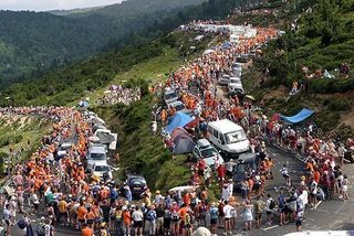 Crowds watch as the riders climb at altitude in the Tour de France 2004.