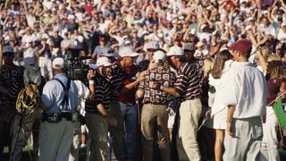 The US team celebrate after winning the 1999 Ryder Cup at Brookline