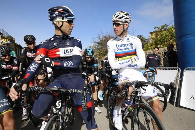 Vicente Reynes (IAM Cycling) and world champion Rui Costa (Lampre-Merida) chat on the start line