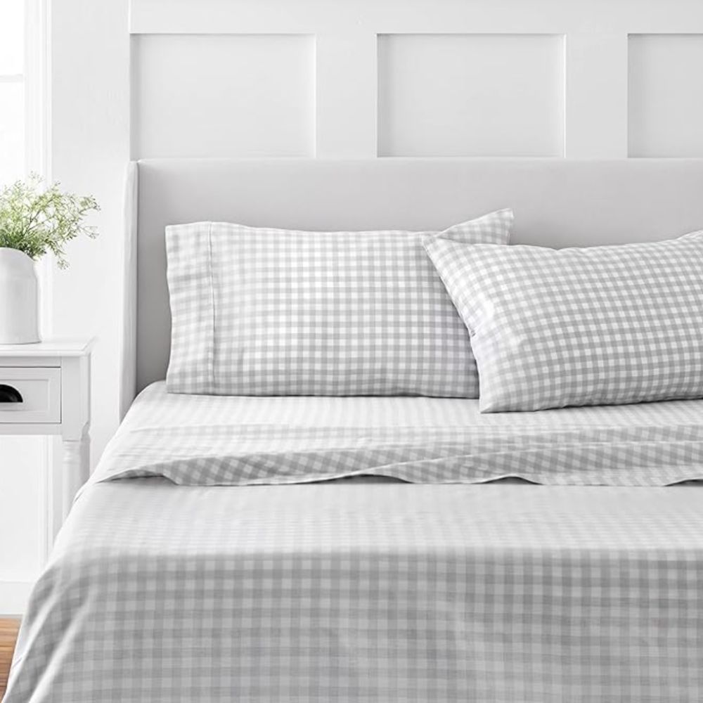 Grey and white gingham sheets on a bed