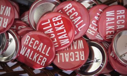 "Recall Walker' pins sit in a basket in the Rock County Democratic Party Headquarters on June 4. Wisconsin Gov. Scott Walker survived.