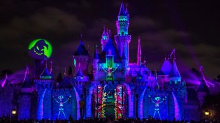 Sleeping Beauty's castle with Oogie Boogie projections for the Oogie Boogie Bash.