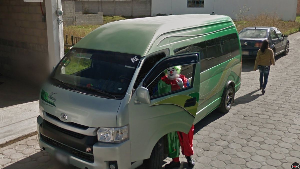 An image of a clown in a van captured by Google Street View and curated by Jon Rafman