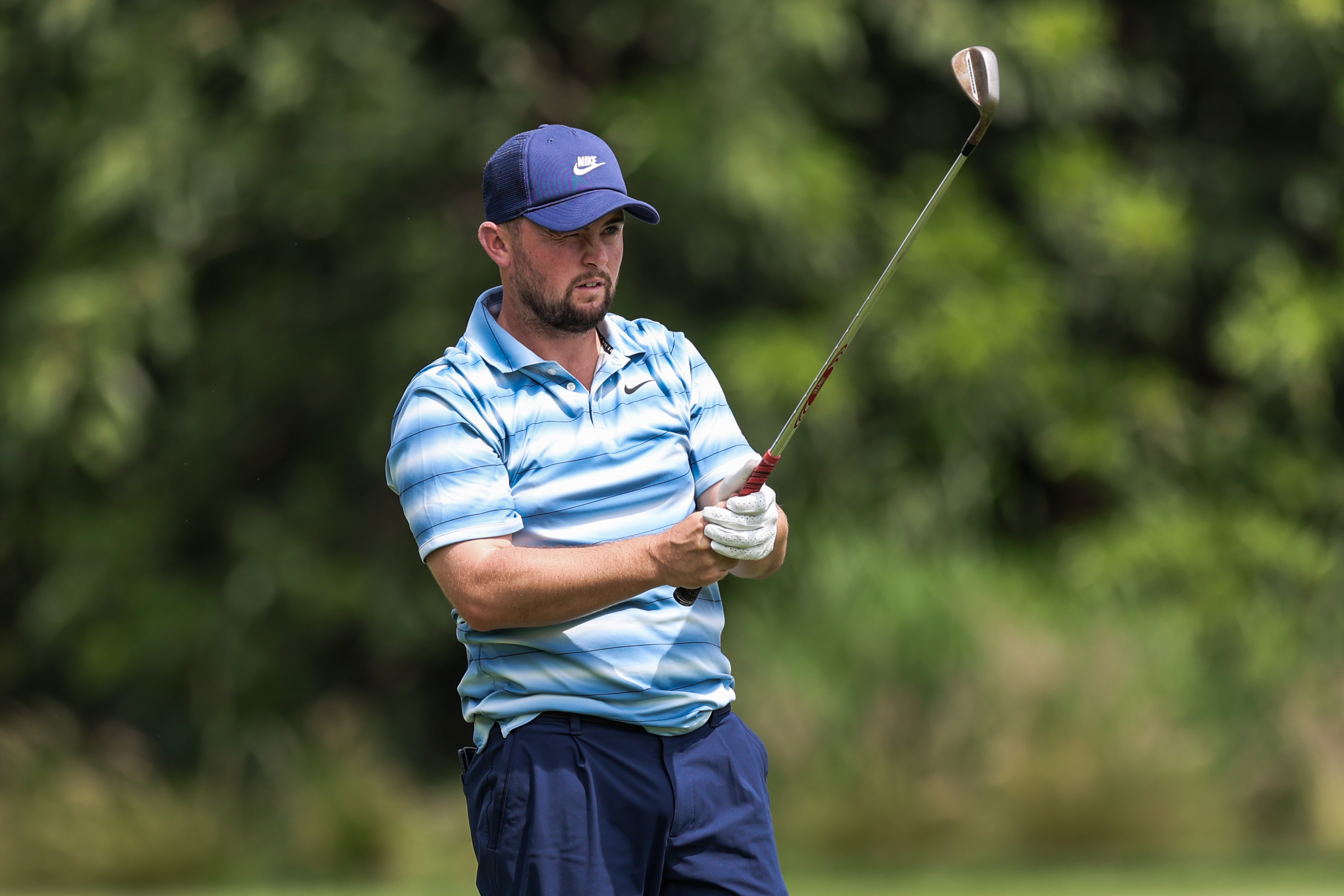 Alex Fitzpatrick lines up his approach on hole 18 on day four of the Hero Indian Open 