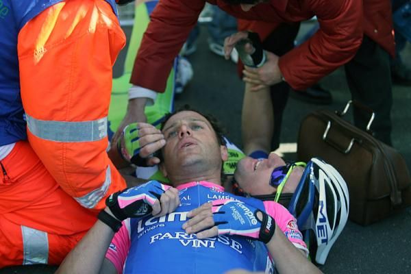 Alessandro Petacchi (Lampre - Farnese Vini) and Fabio Sabatini (Liquigas - Doimo) receive medical attention after crashing in the field sprint.