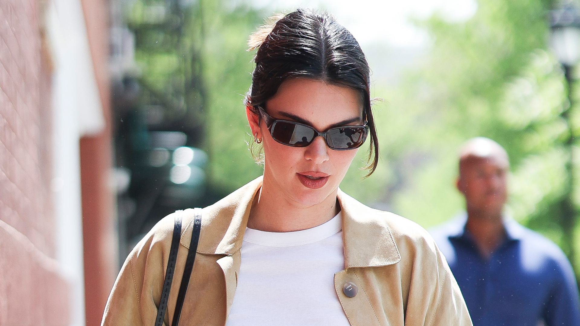 Kendall Jenner wears a white T-shirt with a suede jacket in NYC.