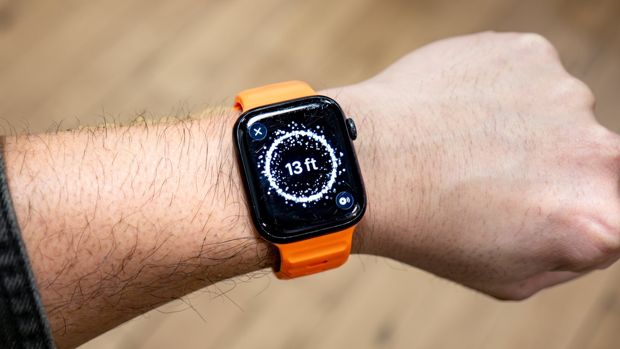 Apple AirTag 2 held in the hand.