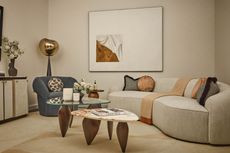 Beige living room with curvy furniture