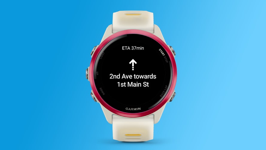 A Garmin Forerunner 570 smartwatch showing directions from Google Maps.