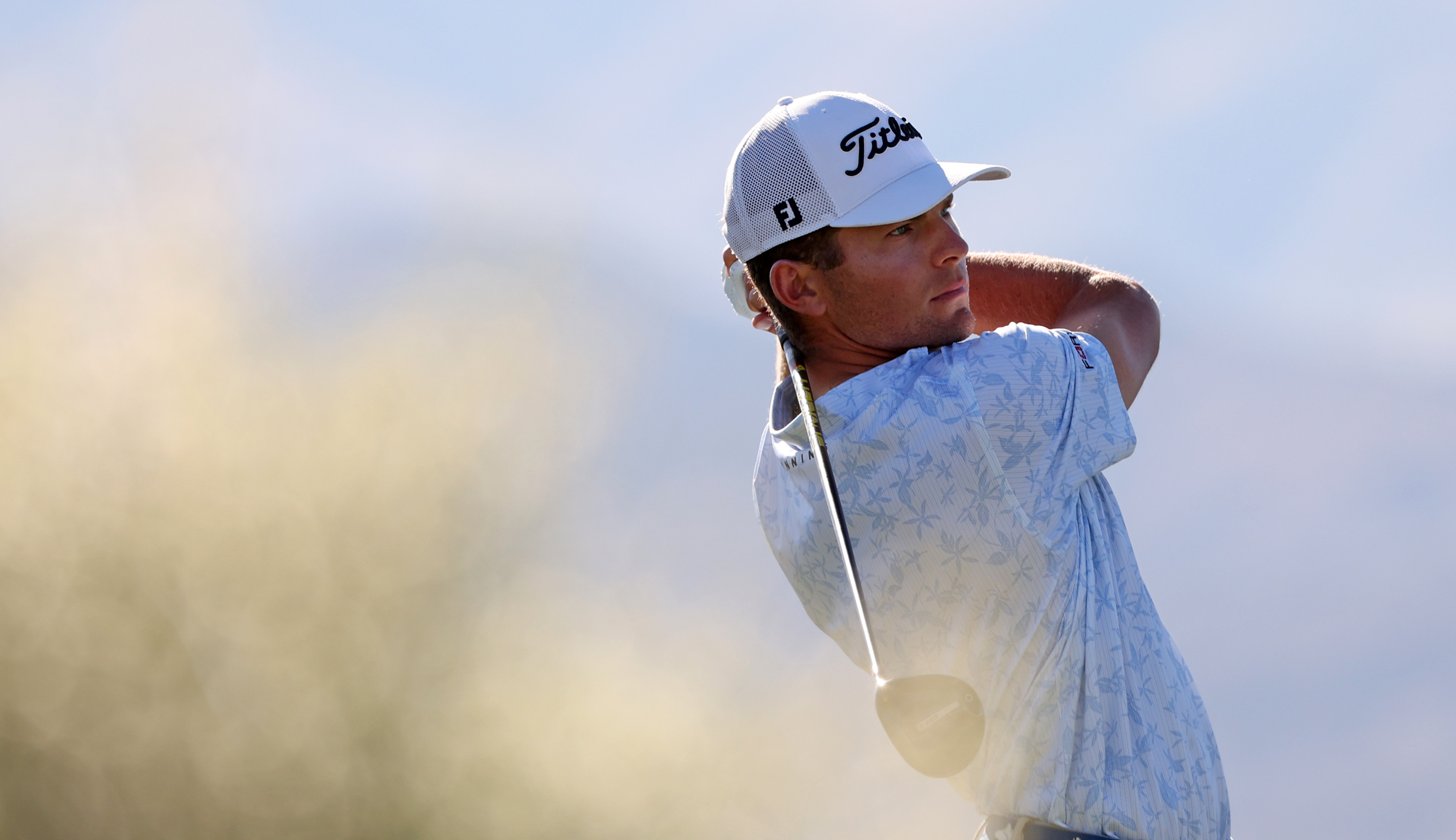 Michael Brennan hits a tee shot