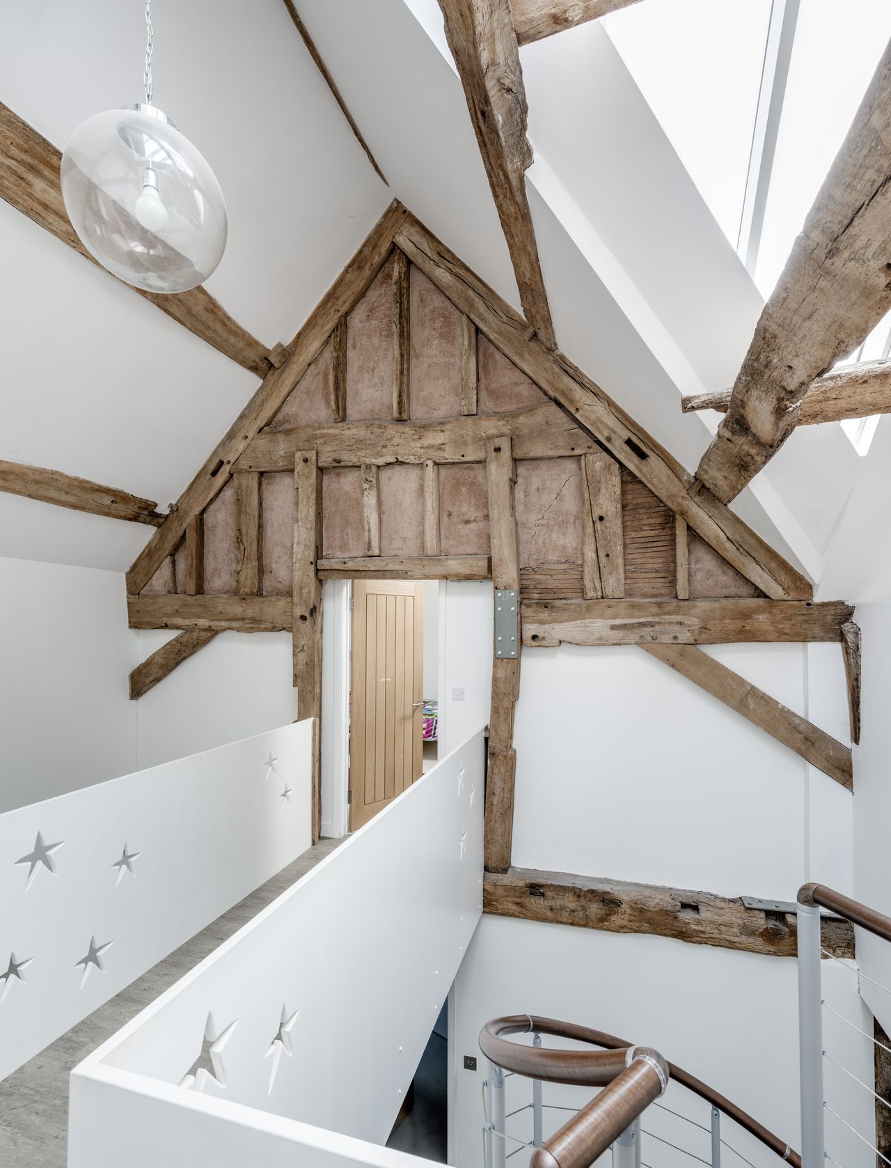 white bridge landing with exposed timber beams