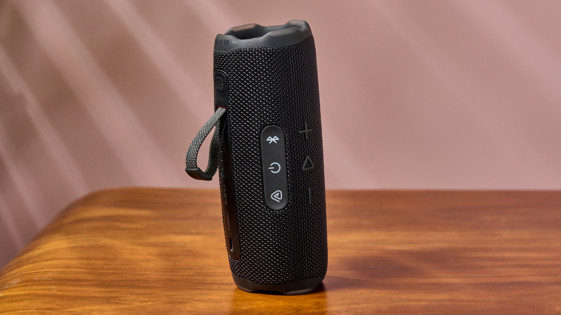 JBL Flip 7 stood upright on table