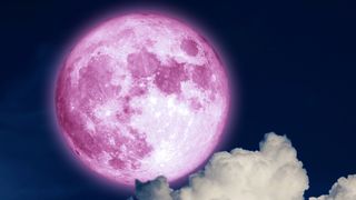 August New Moon 2022: Full pink moon and white silhouette cloud in the night sky.