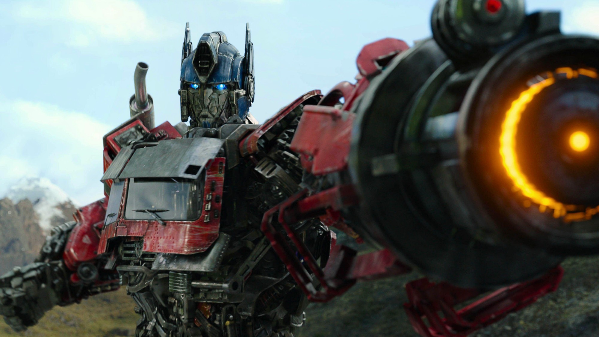 Optimus Prime (voiced by Peter Cullen) readies his fusion cannon in Transformers: Rise of the Beasts.