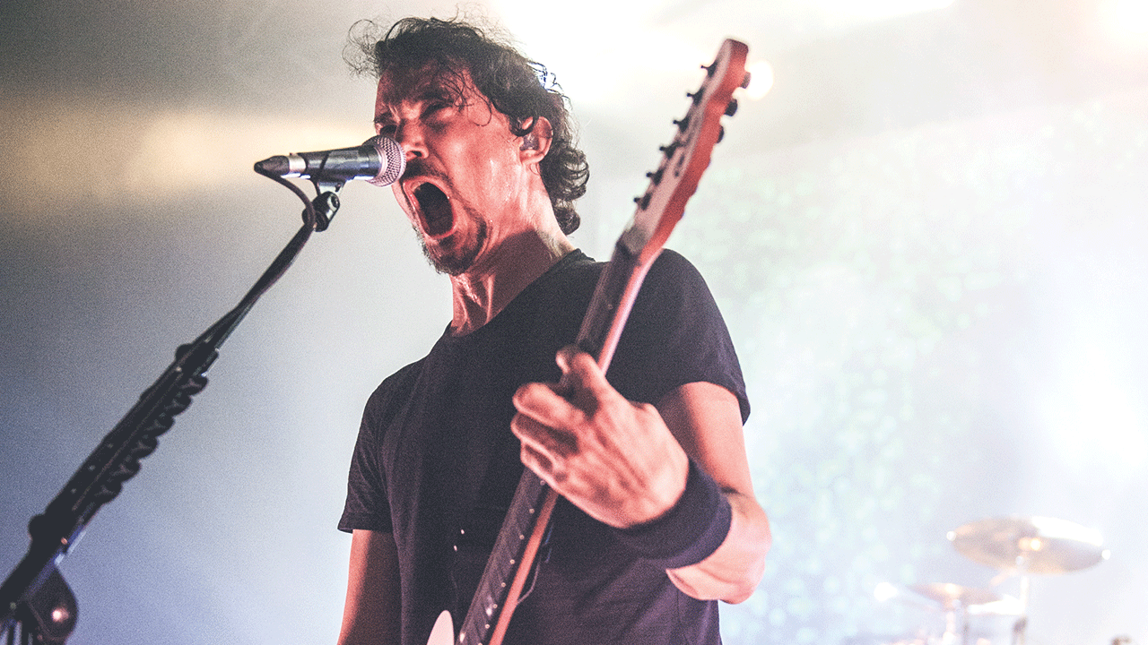 A photograph of Gojira onstage