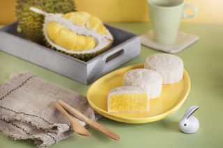 Mid autumn festival food, Malaysia local fruit "Musang King" durian moon cake on coloured background.