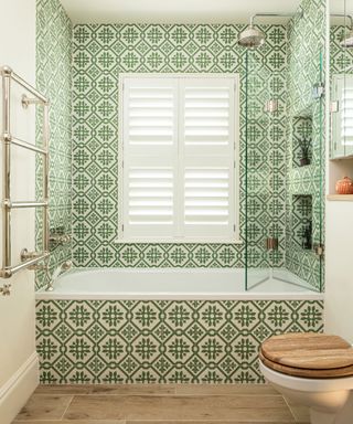 bathroom with green patterned tiles and wood effect ceramic tiles