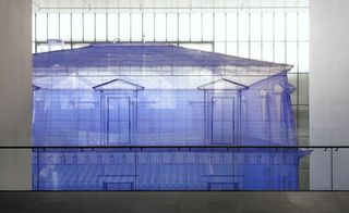 Image of a life-size house made from translucent fabric in blue