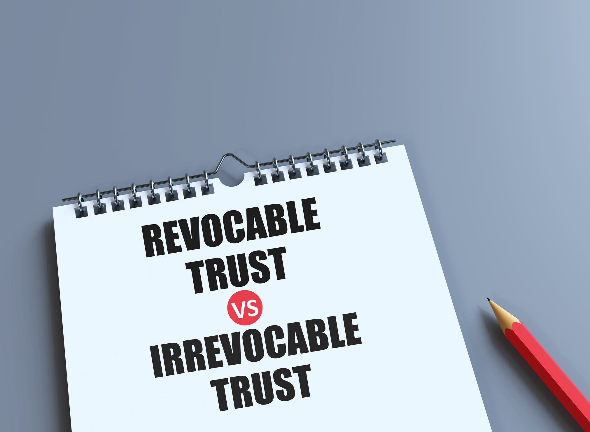 pencil and book with the words Irrevocable Trust vs Revocable Trust