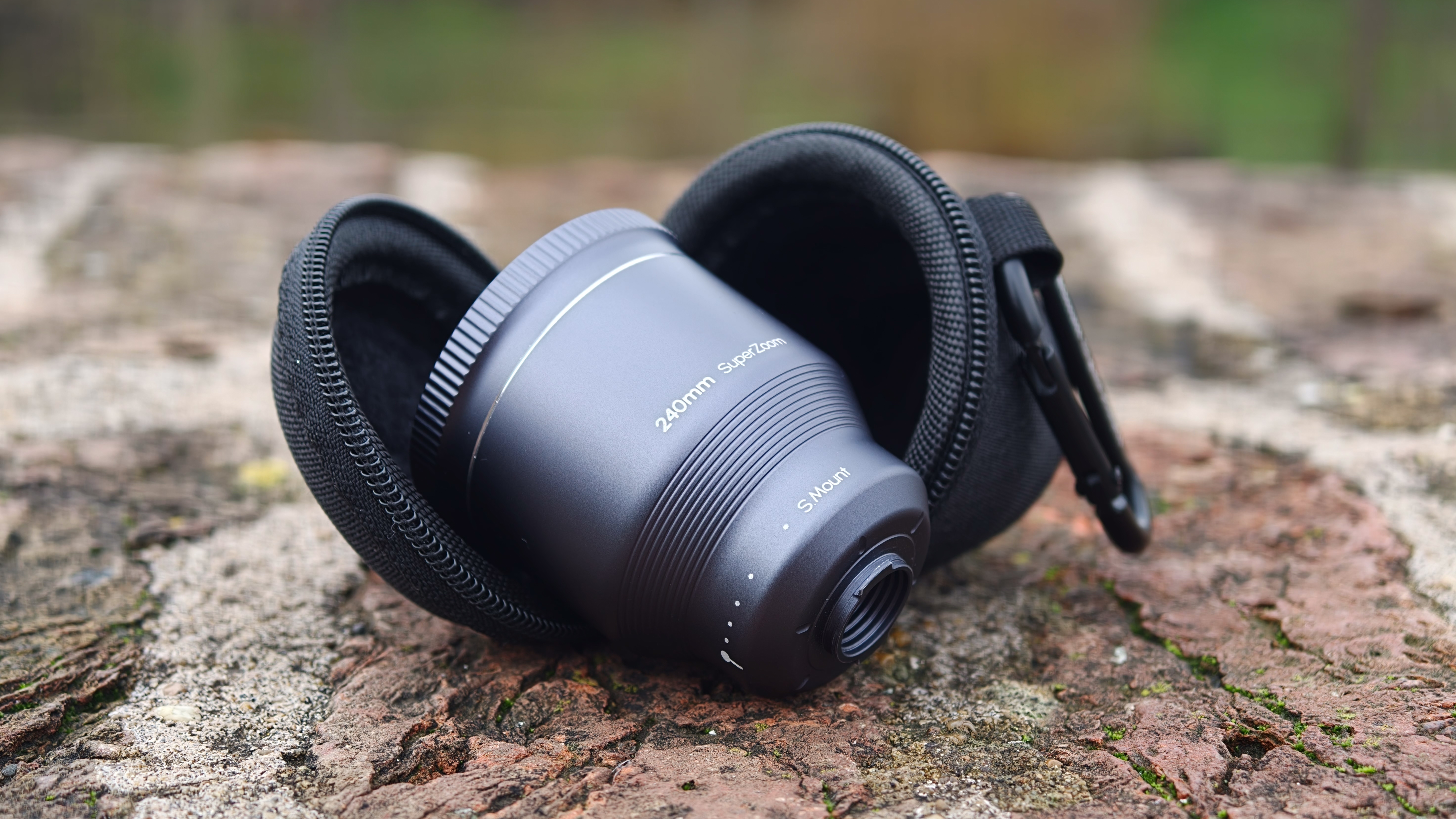 ShiftCam LensUltra Explorer Super Zoom Tele 240mm lens next to its hard shell case