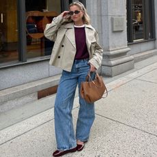 woman in cropped trench and burgundy sweater