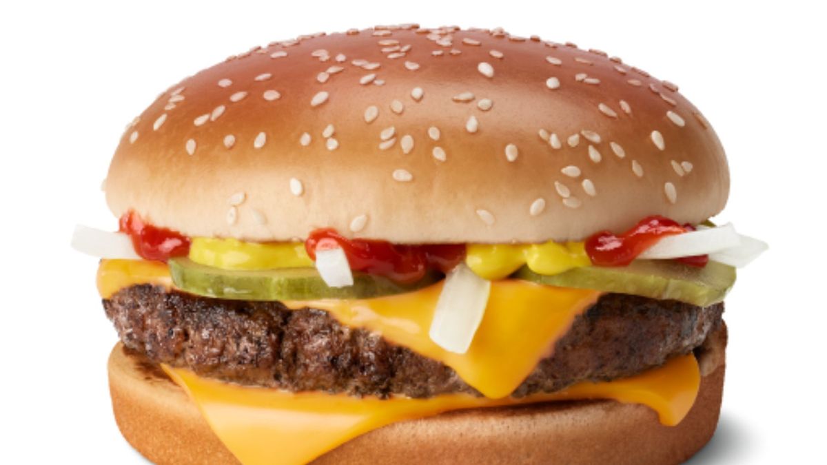 A close-up of a McDonald&#039;s quarter pounder burger against a white background