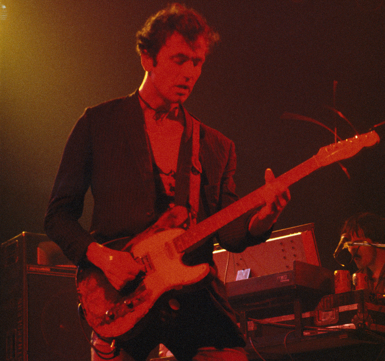 Hugh Cornwell performs onstage with the Stranglers circa 1980