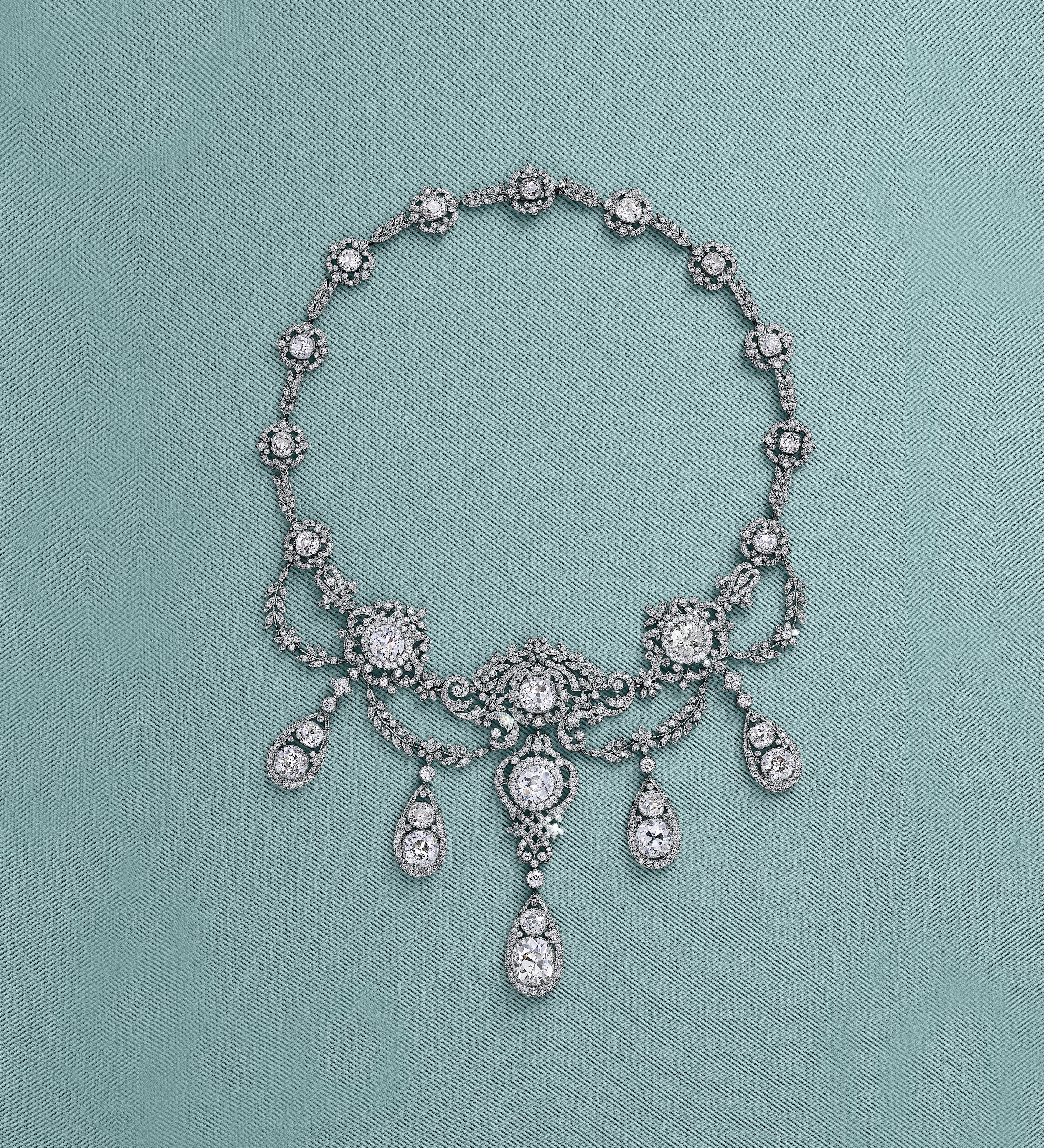 Diamond lace-like necklace on a Tiffany blue background