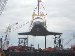 Enterprise Being Hoisted by Crane