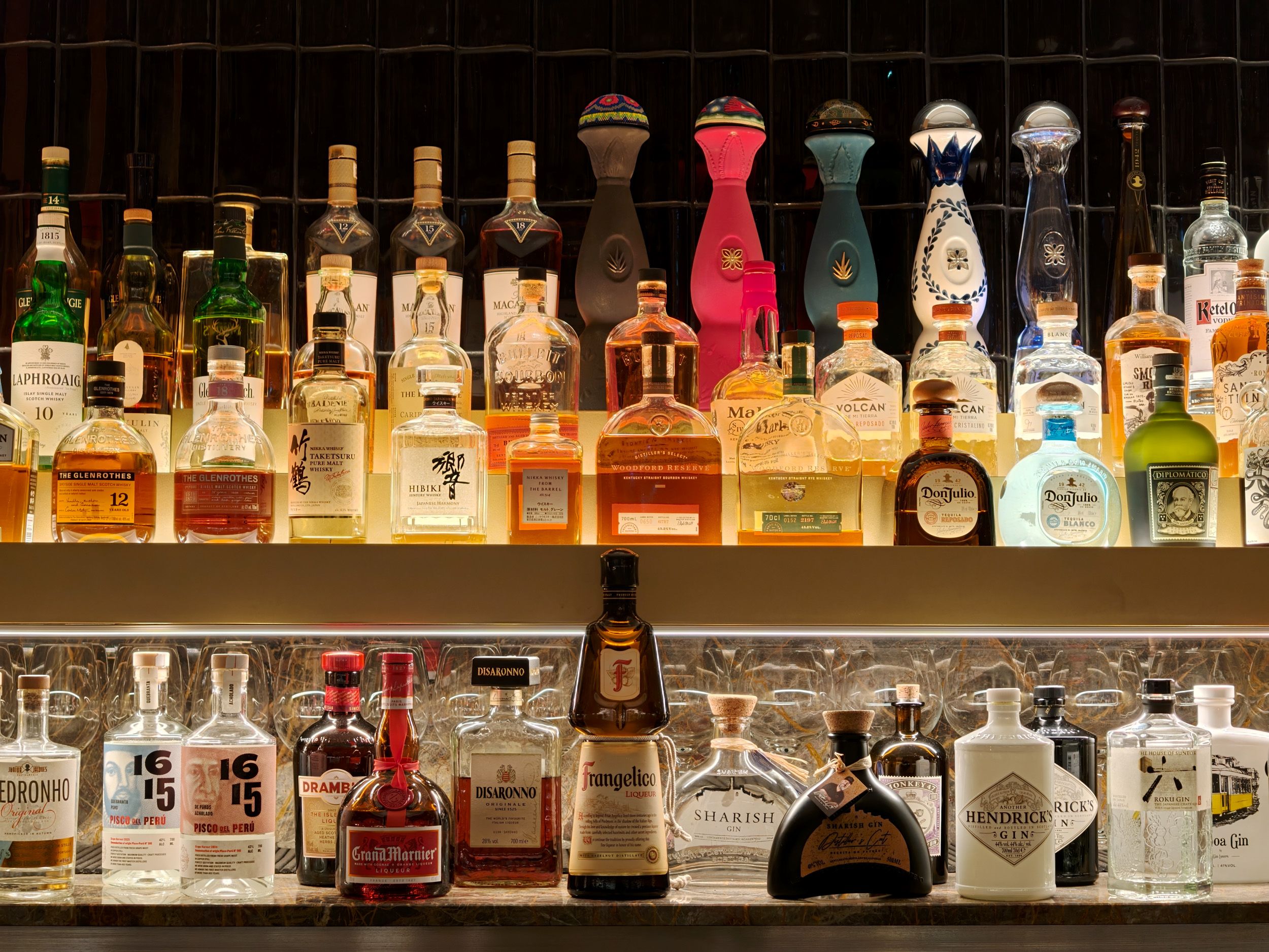 Oppo Find X10 Pro Max image sample gallery: a selection of alcoholic bottles at a bar at night
